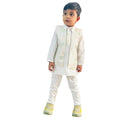 Child wearing a traditional white outfit with a vest on a white background