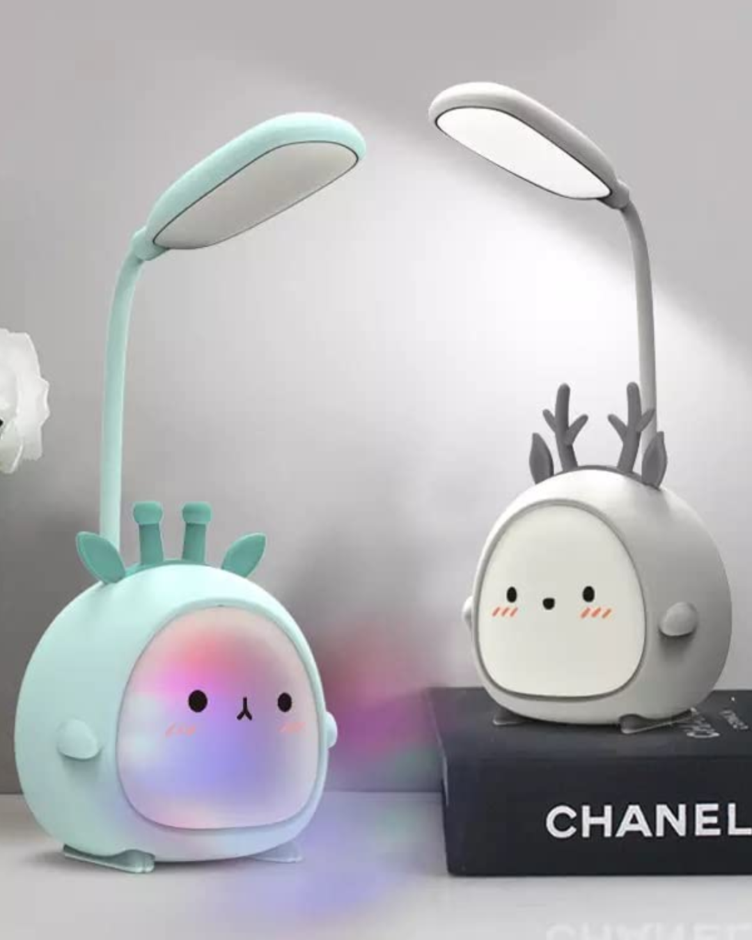 Two cartoon teddy bear-designed LED lamps, one green and one pink, with adjustable goosenecks, illuminated and displaying their respective RGB light modes.