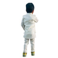 Child wearing a white formal outfit on a white background