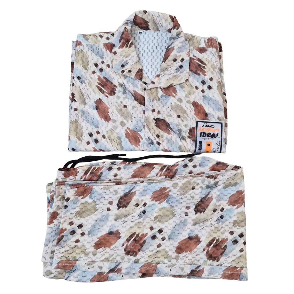 Folded patterned blanket with a matching pouch on a white background