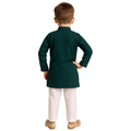 Child wearing a green kurta with white pants on a white background
