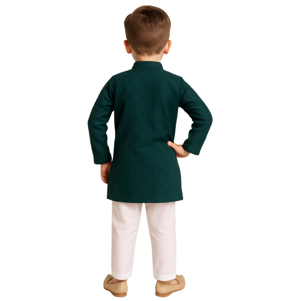 Child wearing a green kurta with white pants on a white background
