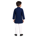 Child wearing a navy blue kurta with white pants on a white background