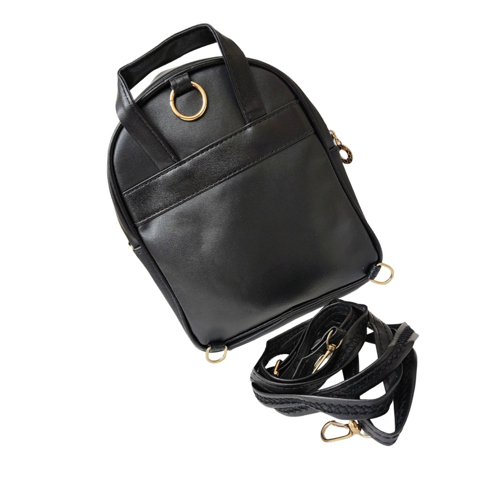 Black leather backpack with gold hardware on a white background