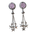 Pair of earrings with pink rose and star designs on a white background