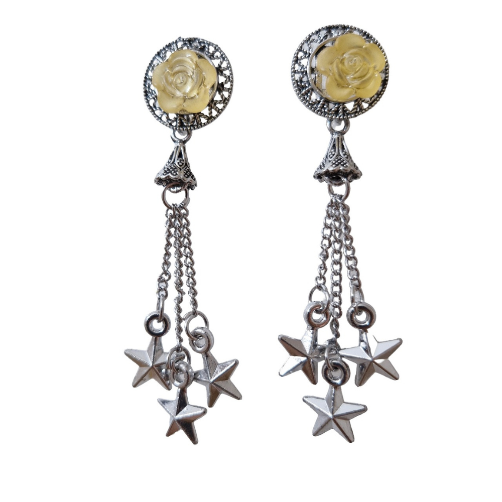 Pair of earrings with star-shaped pendants on a white background