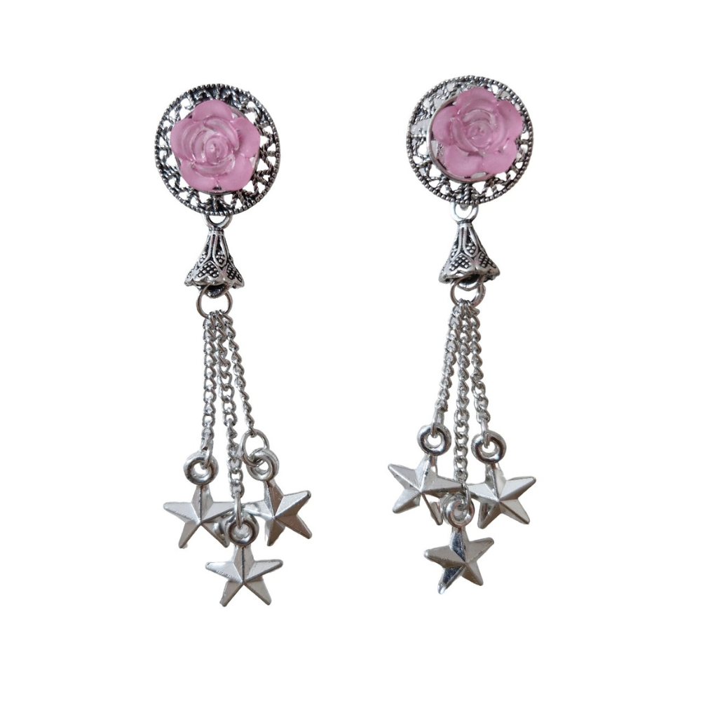 Pair of earrings with pink rose-like stones and star-shaped dangling elements on a white background