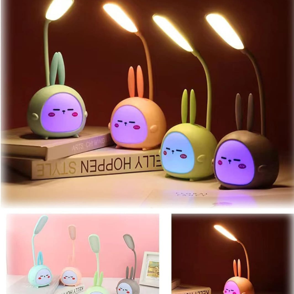 Set of cartoon rabbit-shaped night lights on a wooden surface with a dark background.