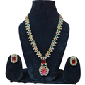 Jewelry set with necklace and earrings on a black stand