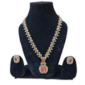 Jewelry set with necklace and earrings on a black stand