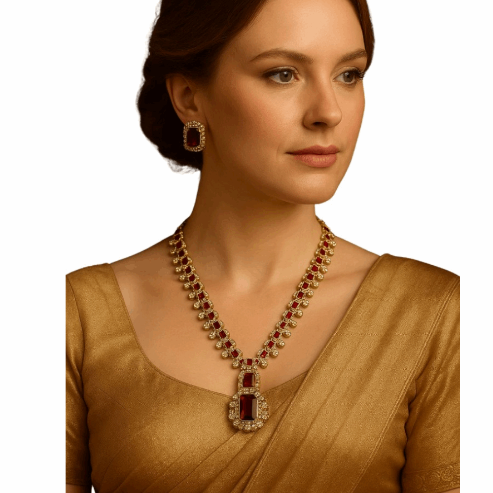 Woman wearing a gold necklace with red stones on a white background