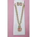 Jewelry set with necklace and earrings on a pink card