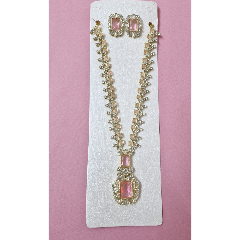 Jewelry set with necklace and earrings on a pink card