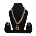 Jewelry set with necklace and earrings on a black stand against a white background