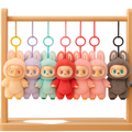 Colorful plush toys hanging on a wooden rack