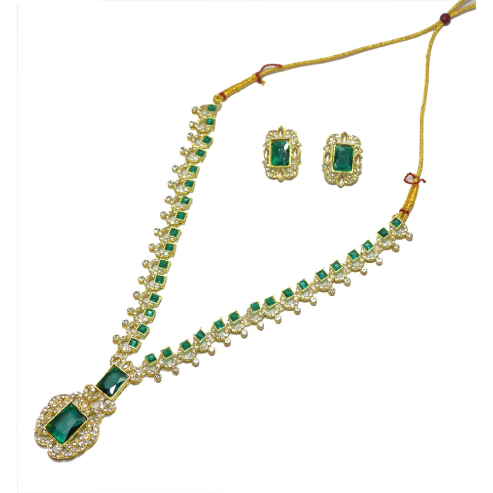 Gold necklace with green gemstones and matching earrings on a white background