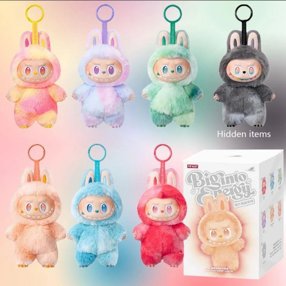 Set of colorful plush toys in costumes with a box labeled 'Big into Puyo' on a gradient background.