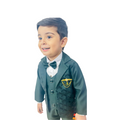 Child wearing a green formal suit with a bow tie on a white background