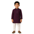 Child wearing a dark purple kurta with white pants on a white background