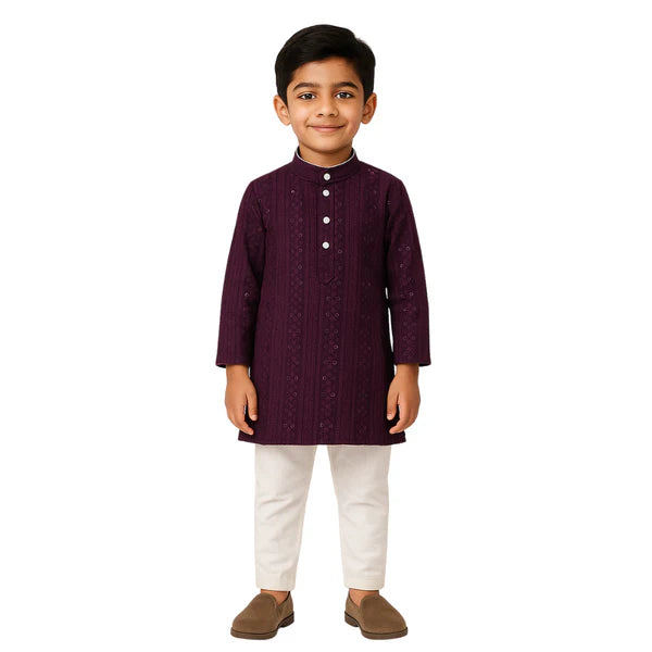 Child wearing a dark purple kurta with white pants on a white background
